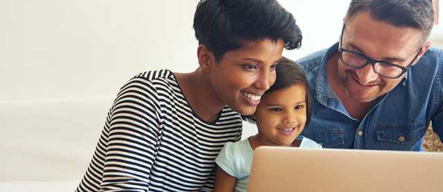 Family Using Laptop Mobile